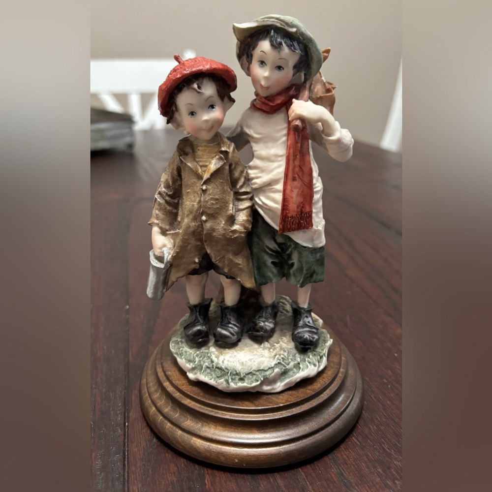 Charming Figurine of Two Boys with Red and Brown Accents